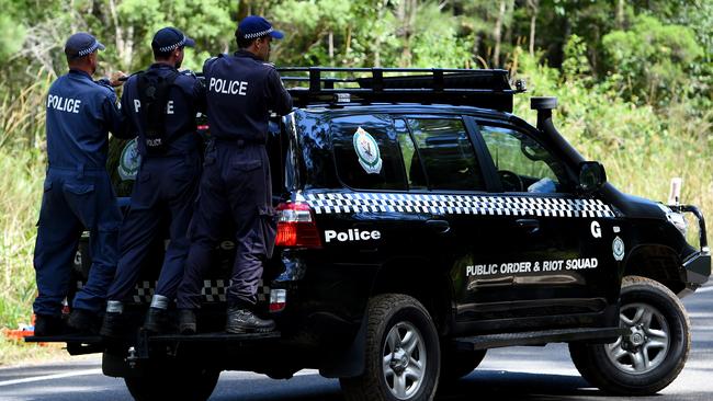 NSW Public Order and Riot Squad Police search near Bonny Hills on the NSW mid-north coast in March, 2015. Picture: AAP/Dan Himbrechts