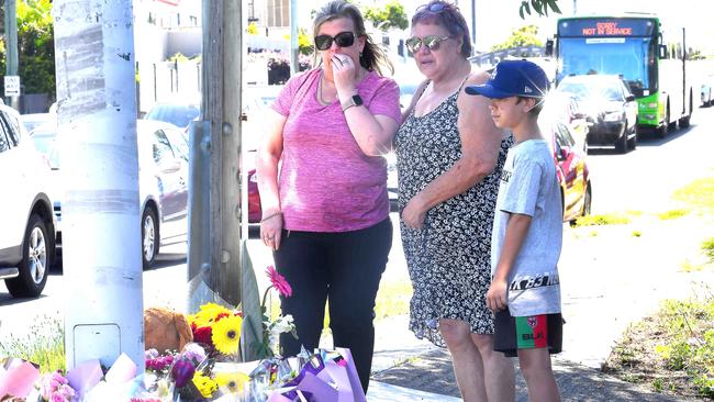 People lay flowers at the crash scene where Matty Field, Kate Leadbetter and their unborn child lost their lives on Tuesday. Picture: John Gass