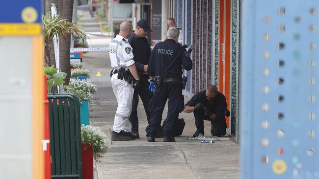 Police at the scene of the arrest of a man at Windang on the NSW south coast. Picture: Richard Dobson