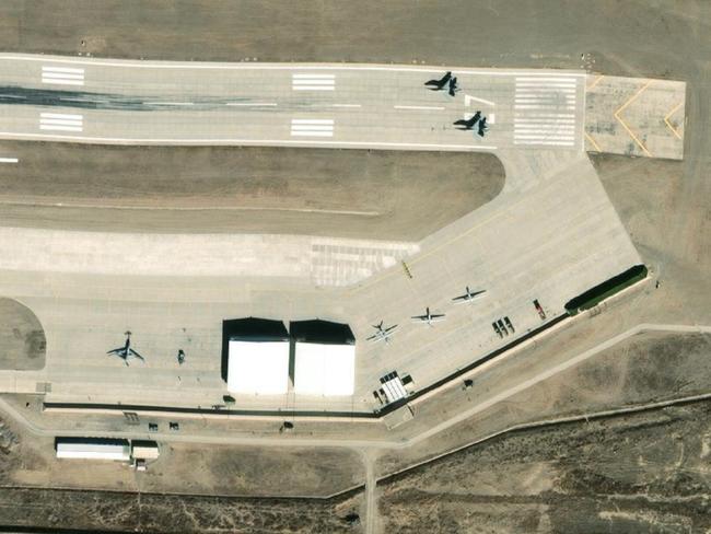 A WZ-7 “Soaring Dragon” surveillance drone, lower left, other drones and two J-11 interceptor fighters (top right) are captured in this February 2024 satellite image. Source: Maxar