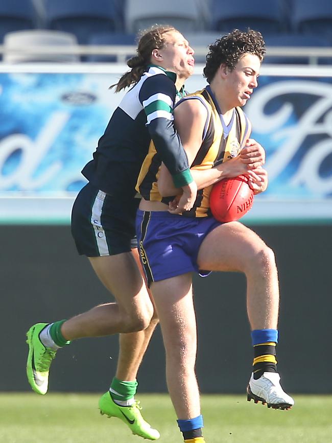 Jake Riccardi marks on the lead for St Bernard’s in the Herald Sun Shield final.