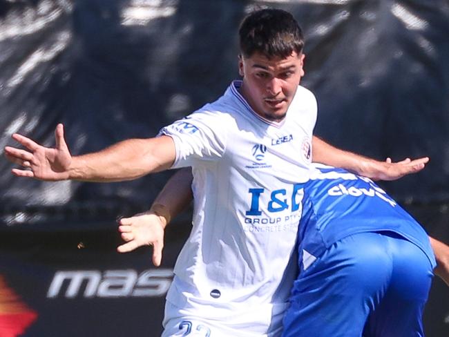 MELBOURNE, AUSTRALIA - FEBRUARY 10 2024 Kristian Trajceski of Avondale and Timothy Atherinos of Dandenong City during the NPL Victoria game between Avondale v Dandenong City at Reggio Calabria Club.Picture: Brendan Beckett