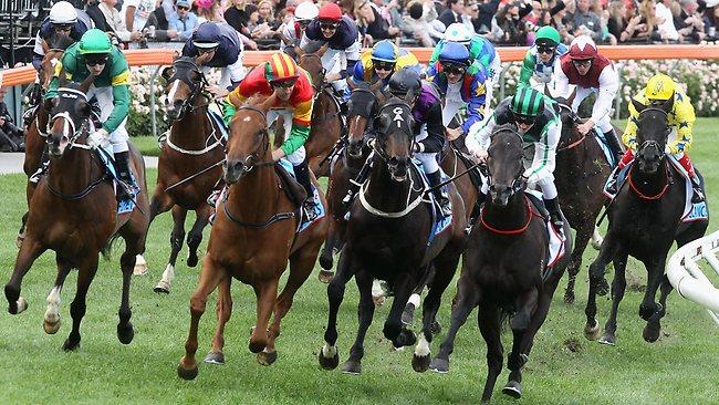 It's theirs as jockey Chad Schofield and Shamus Award cross the line in the Cox Plate. Picture: Michael Klein