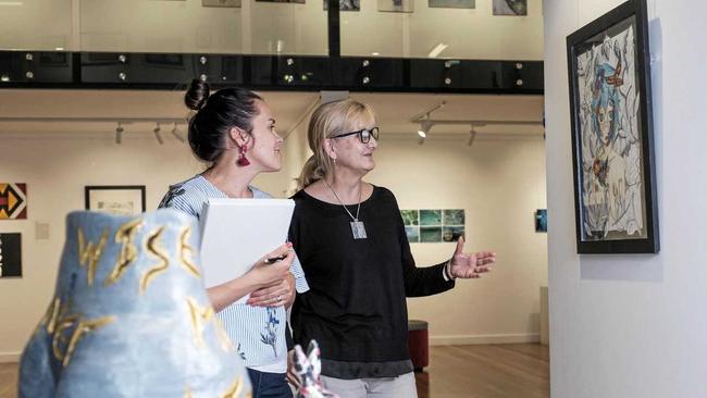 ART ON SHOW: Visual art teacher Sonia Miers and subject area coordinator for visual art Alison Roberts inspecting the students' artwork ahead of tonight's Dalby State High School annual Art Show opening night. Picture: Matthew Newton