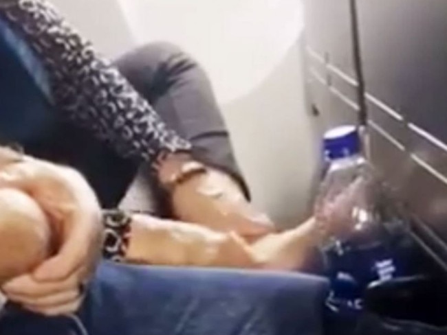 A passenger was caught scrubbing her foot while on a plane. Picture: Passenger Shaming