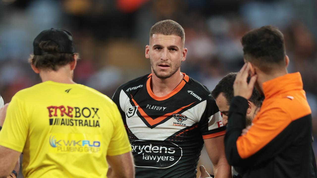SYDNEY, AUSTRALIA - APRIL 10: Adam Doueihi of the Wests Tigers walks from the field injured during the round six NRL match between Wests Tigers and Parramatta Eels at Accor Stadium on April 10, 2023 in Sydney, Australia. (Photo by Mark Metcalfe/Getty Images)