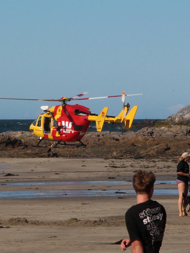 Emergency services arrive at the scene of the tragedy at Surf Beach, about 8km south of Batemans Bay, on Sunday. Pictures: Helen Hall