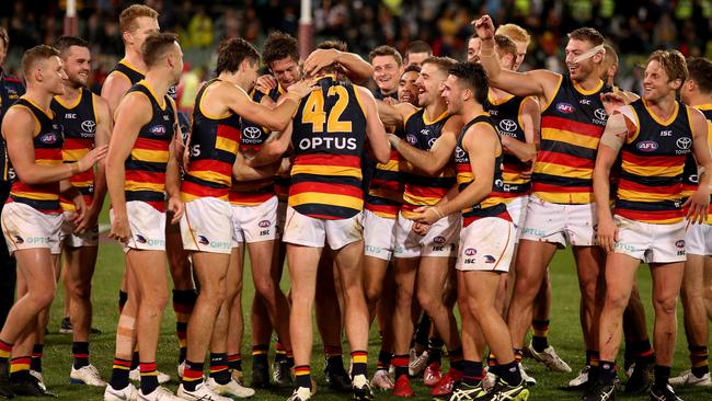 Alex Keath is swamped by his teammates after winning the Showdown Medal in Round 8. Picture: James Elsby (Getty).