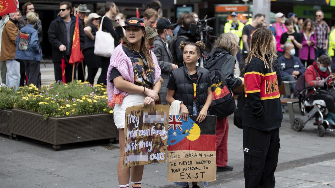 One woman’s sign said: “They r**ted their own family while they uprooted ours”.. Picture: NCA NewsWire / Nikki Short