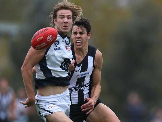 Marty Hore looks to bring down Carlton’s Harry McKay. Picture: Stuart Milligan