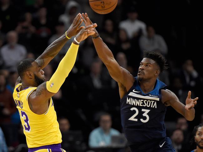 LeBron James shoots over Jimmy Butler.