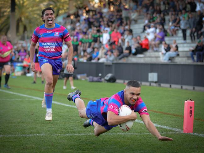 Craig McKenzie (left) helped set up Kieren Mundine for one of the tries of the Souths Juniors season. Picture: Adam Wrightson Photography