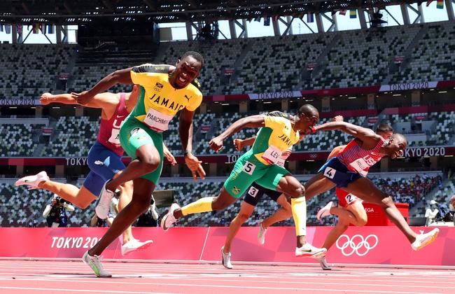 Hansle Parchment of Team Jamaica gives his all to finish first ahead of Grant Holloway (right) of Team United States and Ronald Levy (centre) of Team Jamaica to win the gold medal in the Men's 110m Hurdles Final. Picture: Matthias Hangst/Getty Images