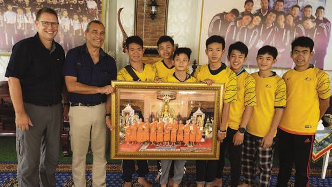 Richard Harris and Craig Challen meet six players from the Wild Boars soccer team and their coach months after the July 2018 rescue.