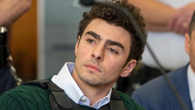 Luigi Mangione, accused killer of US insurance CEO Brian Thompson, sits in Manhattan Supreme Court as he attends a hearing in New York City on February 21, 2025. Mangione is accused of gunning down Thompson in a brazen hit in New York on December 4, 2024, pleaded not guilty to state charges including "terrorist" murder. The suspect is charged in both state and federal court. (Photo by Steven HIRSCH / POOL / AFP)