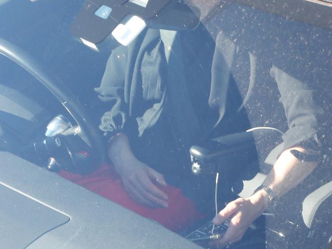 A person in the drivers seat of their car on their phone while at a set of traffic lights, Warringa Road, Frenchs Forest, Sydney. 24th September, 2019. Picture by Damian Shaw