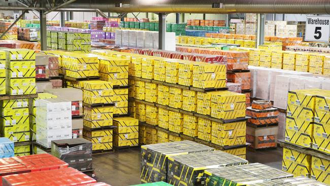 Pallets of wine stacked in a warehouse at the Casella winery at Griffith. Picture: Dylan Robinson