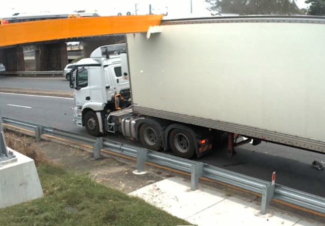 A truck becomes wedged after trying to pass under the Rocklea railway bridge on Muriel Ave. Picture: Queensland Rail