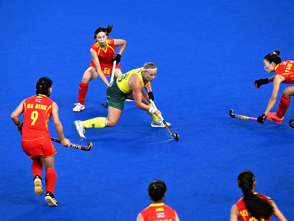 Australia’s Courtney Schonell (C) is surrounded by Chinese defenders during the FIH Hockey Pro League match in Sydney. Picture: AFP