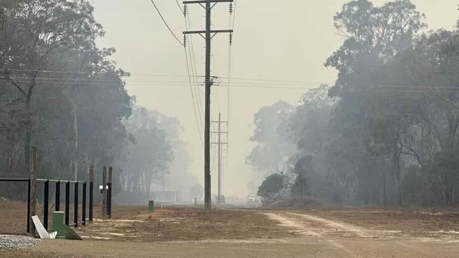 Fire crews are currently fighting to control a grassfire just outside of Burrum Town.