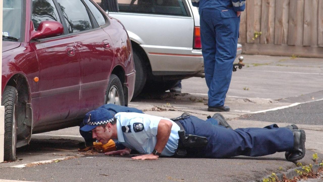 Police search the scene of Michael Marshall’s murder on Joy St, South Yarra.