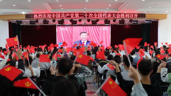 The flag-waving crowd at the opening of the CCP congress. Picture: AFP