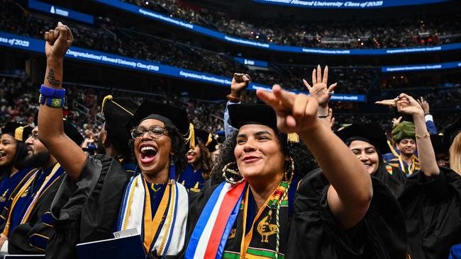 Graduates cheer during the 2023 Howard University Spring graduation ceremony at Capitol One Arena in Washington. Picture: AFP