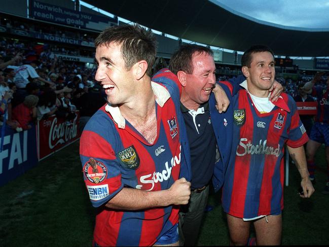 Andrew Johns (left) celebrates the 1997 premiership win with dad Gary and brother Matthew (right). Picture: Andrew Darby.