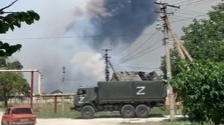 A Z-marked army vehicle is pictured rushing to the scene.