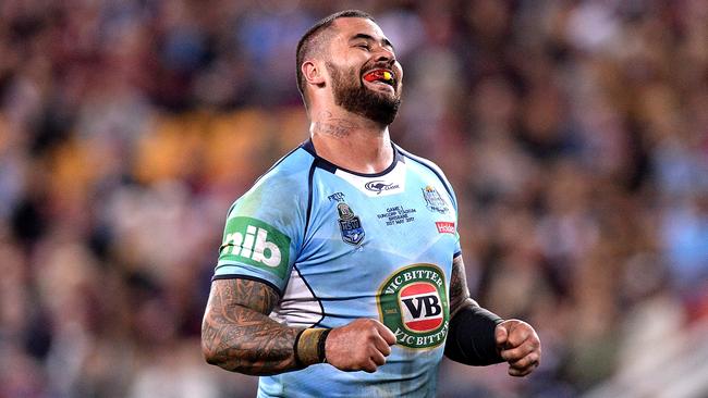 Andrew Fifita smiles at the crowd after scoring a try.