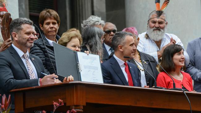 Attorney-General Kyam Maher, left, Governor Frances Adamson, Premier Peter Malinauskas and deputy Premier Susan Close sign the bill on the steps of Parliament House to pass the nation’s first Voice to Parliament. Picture: NCA NewsWire / Brenton Edwards