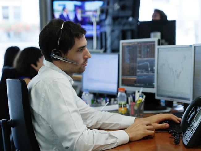 Trading rooms around the world were hit with disbelief and shock over the result. Picture: AFP/Thomas SAMSON