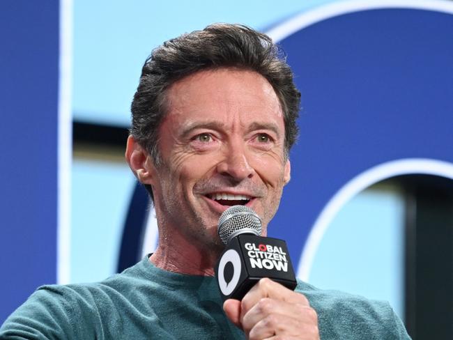 NEW YORK, NEW YORK - APRIL 30: (L-R) Hugh Jackman and Rachel Brosnahan speak onstage during Global Citizen NOW at Spring Studios on April 30, 2025 in New York City. (Photo by Noam Galai/Getty Images for Global Citizen)