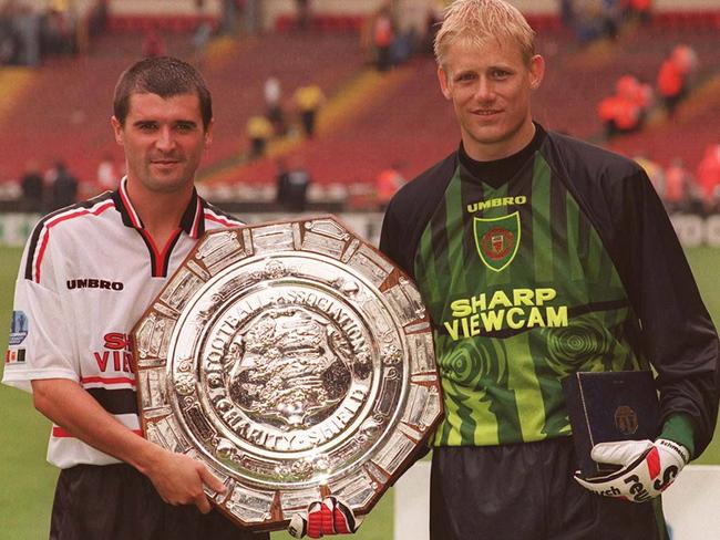 Roy Keane and Peter Schmeichel in trophy-winning days.