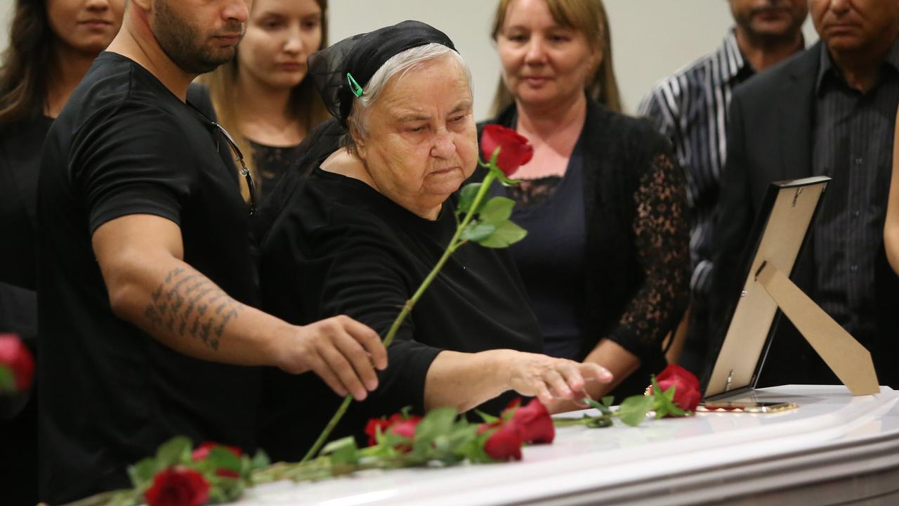 Memorial service for Luliana Triscaru, at Tudor Park community centre, Loganholme. Family members at the coffin. Picture: Jono Searle.