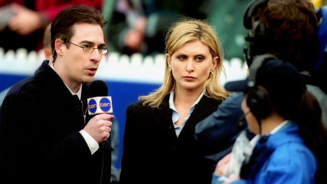 Gerard Whateley and Christi Malthouse on the boundary line during the 2002 Grand Final.