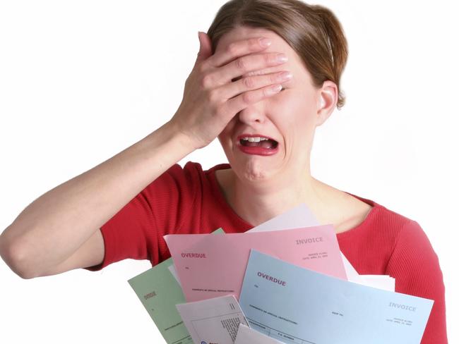 A stressed woman trying to cope with her household bills.