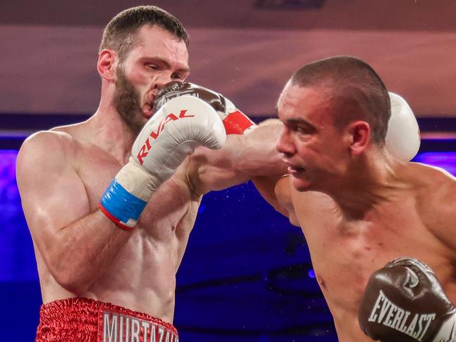 ORLANDO, FLORIDA - OCTOBER 19: Tim Tszyu punches Bakhram Murtazaliev in the nose at Caribe Royale Orlando on October 19, 2024 in Orlando, Florida. (Photo by Alex Menendez/Getty Images)