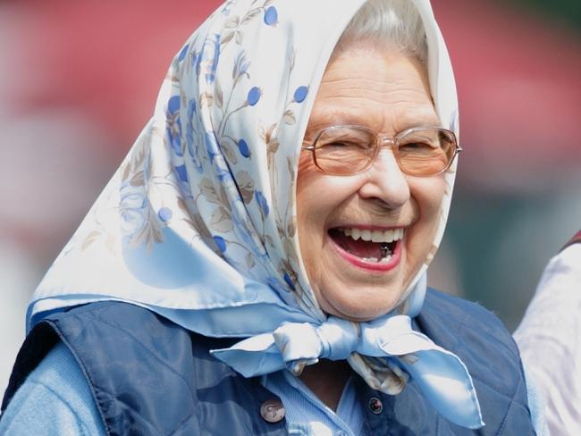 WINDSOR, UNITED KINGDOM - MAY 12: (EMBARGOED FOR PUBLICATION IN UK NEWSPAPERS UNTIL 48 HOURS AFTER CREATE DATE AND TIME) Queen Elizabeth II laughs as she receives a Tesco Gift Card as a prize after her horse 'Barber's Shop' won the Tattersalls and RoR Thoroughbred Ridden Show Series Championship on day 2 of the Royal Windsor Horse Show in Home Park on May 12, 2016 in Windsor, England. (Photo by Max Mumby/Indigo/Getty Images)