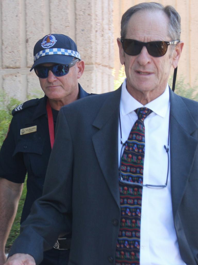 NT Police sergeant Lee Bauwens (rear) leaves the Alice Springs Local Court in February 2024 after giving evidence at an inquest into the death of Kumanjayi Walker. Picture: Jason Walls