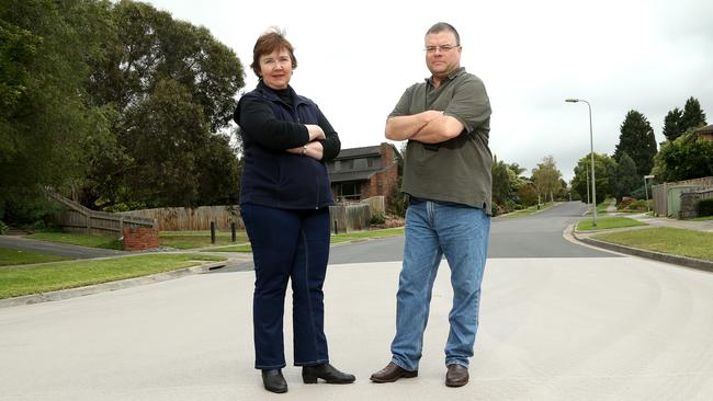 Leanne White and Clarke Stevenson are unimpressed with Manningham Council’s to resurface Deep Creek Drive in Doncaster East. Picture: Hamish Blair