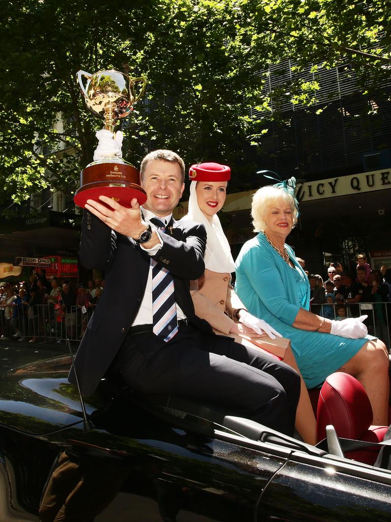 VRC Chairman Michael Burn (L) holds the Melbourne Cup alongside acting Lord Mayor Susan Riley (R) during  the 2014 Melbourne Cup parade on November 3, 2014 in Melbourne, Australia. Picture: Getty