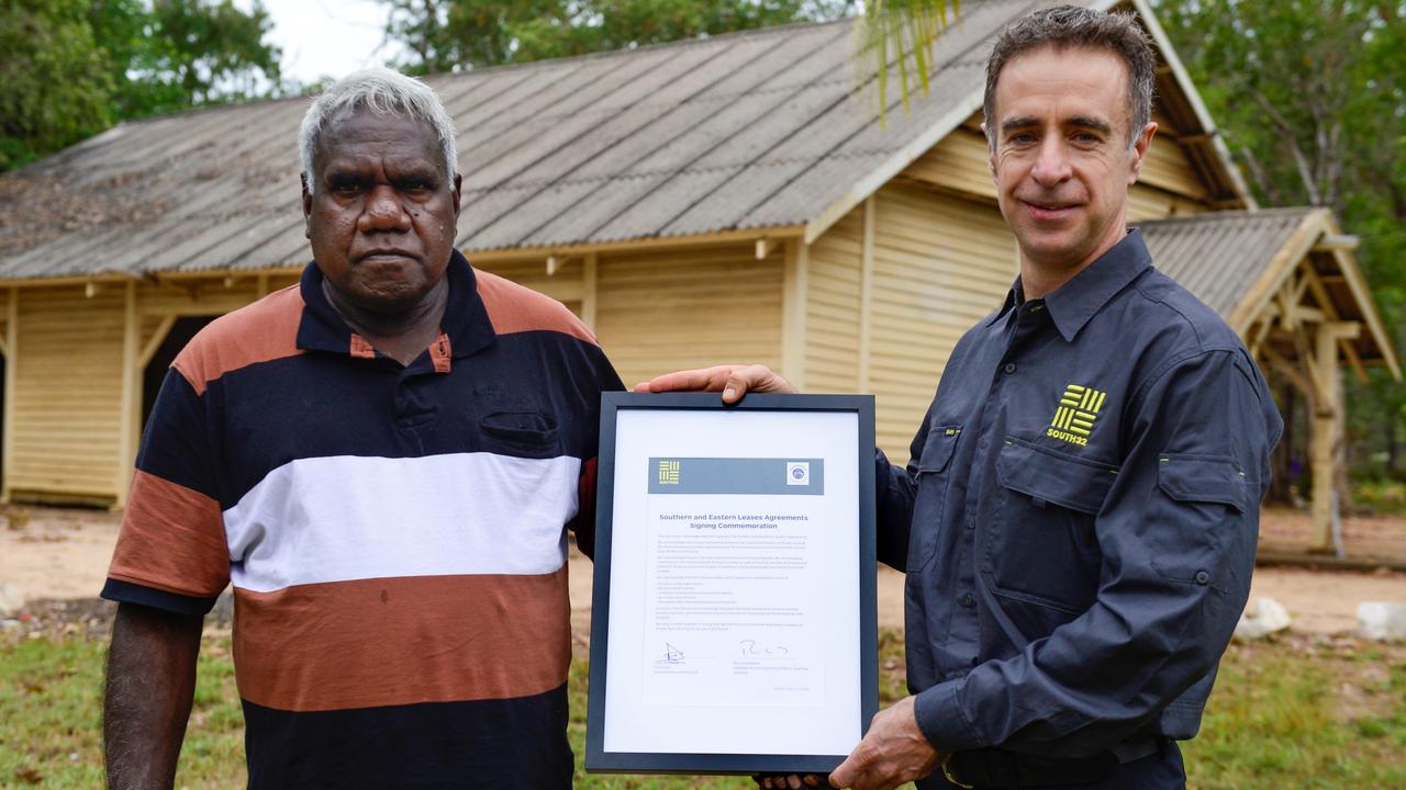 Late Anindilyakwa Land Council chairman T Wurramarrba and South32 president Ricus Grimbeek at a land access agreement signing ceremony on Groote Eylandt in 2016.