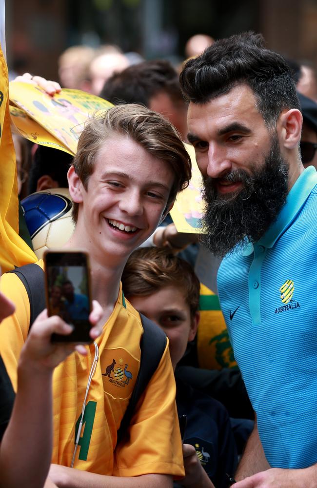 Socceroos captain Mile Jedinak signs autographs. Picture: Toby Zerna