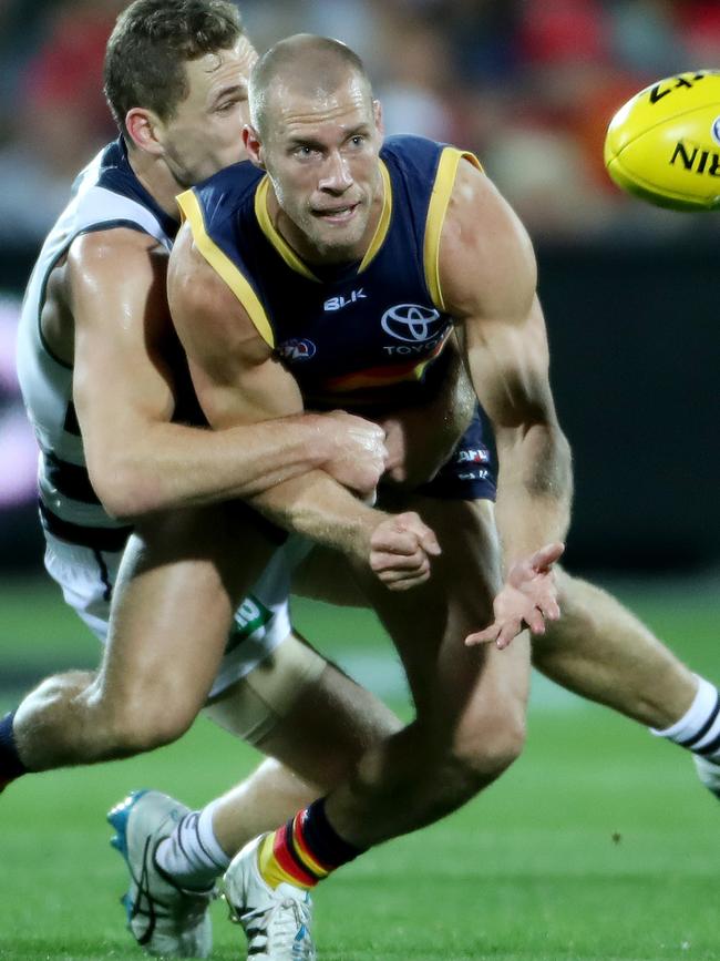 Scott Thompson fires out a handball while playing for the Crows against Geelong in 2016. Picture: Calum Robertson.