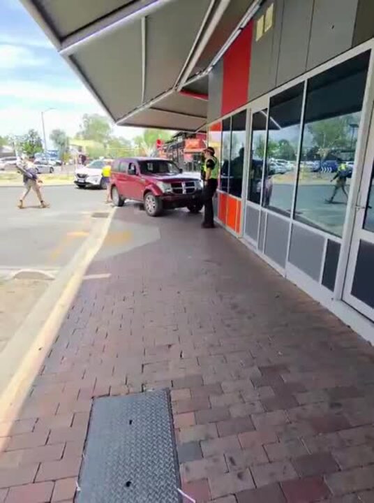 Police on scene after car crashes into NT politician's office