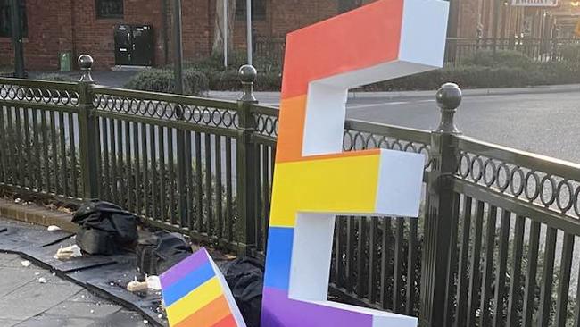 Vandals have destroyed the rainbow sign.