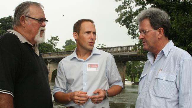 In 2009, Mulgrave's Labor candidate Curtis Pitt talks with Cassowary Coast councillors Ian Rule (left) and Mark Nolan (right) about the ageing Jubilee Bridge, saying replacing it is his top priority for Innisfail.