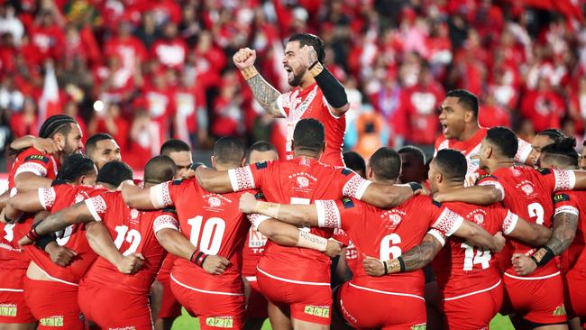 Andrew Fifita leads the Tonga players as they perform the Sipi Tau. Picture: AFP