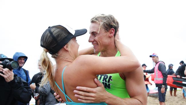 Matt Bevilacqua celebrates after winning the 2018 series with his girlfriend Brielle Cooper who won the women's series, in the Nutri-Grain Ironman Final at North Cronulla, Sydney. Picture: Brett Costello